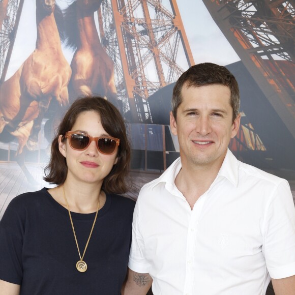 Marion Cotillard et son compagnon Guillaume Canet - People lors du Longines Paris Eiffel Jumping au Champ-de-Mars à Paris, le 4 juillet 2015.