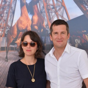 Marion Cotillard et son compagnon Guillaume Canet - People lors du Longines Paris Eiffel Jumping au Champ-de-Mars à Paris, le 4 juillet 2015.