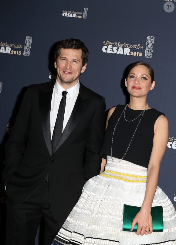 Guillaume Canet et Marion Cotillard - Photocall de la 40ème cérémonie des César au théâtre du Châtelet à Paris. Le 20 février 2015.