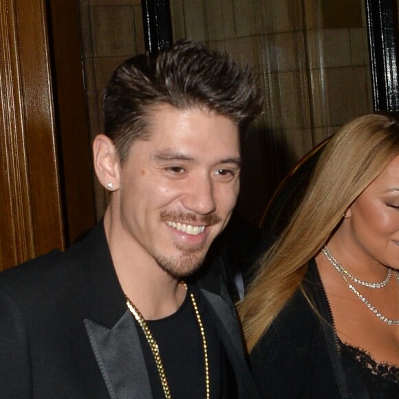 Mariah Carey arrive avec son danseur Brian Tanaka à une réception de mariage à l'hôtel Landmark à Londres le 14 janvier 2017.