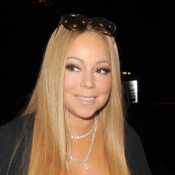 Mariah Carey arrive avec son danseur Brian Tanaka à une réception de mariage à l'hôtel Landmark à Londres le 14 janvier 2017.