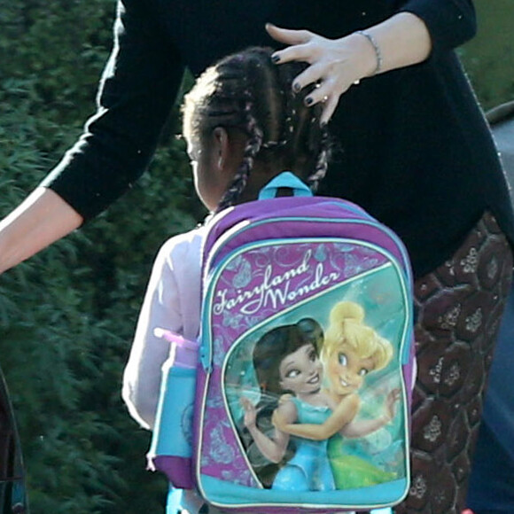 Exclusif - Charlize Theron se balade avec son fils Jackson dans les rues de Los Angeles, le 17 janvier 2017.. Le petit Jackson est encore habillé en fille, il porte des bottes fourrées rose, un sac à dos 'Reine des neiges' et est coiffé de longues tresses.