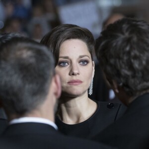 Marion Cotillard et son compagnon Guillaume Canet (de dos) - Descente des marches du film "Juste la fin du monde" lors du 69e Festival International du Film de Cannes. Le 19 mai 2016. © Olivier Borde-Cyril Moreau/Bestimage