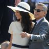 George Clooney et sa femme Amal Alamuddin quittent le palais de Ca Farsetti à Venise, le 29 septembre 2014