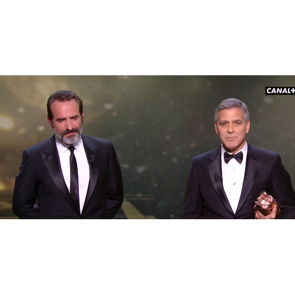 Jean Dujardin et George Clooney pendant les César 2017.