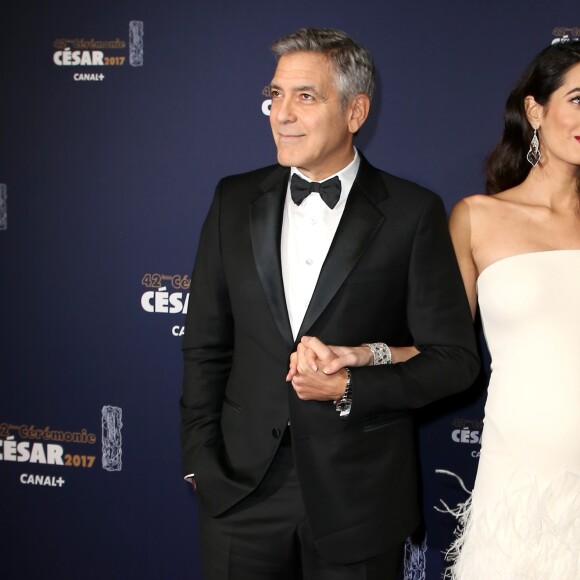 George Clooney et sa femme Amal Alamuddin-Clooney (enceinte) arrivant à la 42e cérémonie des César à la Salle Pleyel à Paris le 24 février 2017. © Olivier Borde / Dominique Jacovides / Bestimage