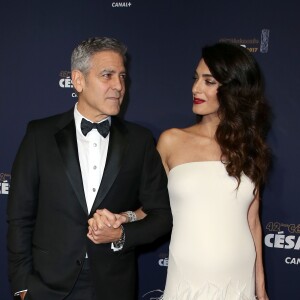 George Clooney et sa femme Amal Alamuddin-Clooney (enceinte) arrivant à la 42e cérémonie des César à la Salle Pleyel à Paris le 24 février 2017. © Olivier Borde / Dominique Jacovides / Bestimage