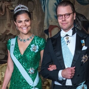 La princesse Victoria (en robe Elie Saab) et le prince Daniel de Suède lors du premier dîner officiel de l'année au palais royal Drottningholm à Stockholm le 23 mars 2017.