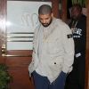 Drake and his entourage leave Madeo Italian restaurant in West Hollywood. The Canadian rapper dressed casual in a tan coat over a grey top, blue track pants and a pair of Nike, Los Angeles, CA, USA on April 4, 2017. Photo by Spread Pictures/ABACAPRESS.COM05/04/2017 - Los Angeles