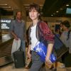 Charlotte Gainsbourg arrive à l'aéroport de Nice, habillée d'un bomber Haider Ackermann (collection masculine printemps-été 2015), tenant un sac sacai et chaussée de baskets Common Projects (modèle Achilles). Le 16 mai 2017.