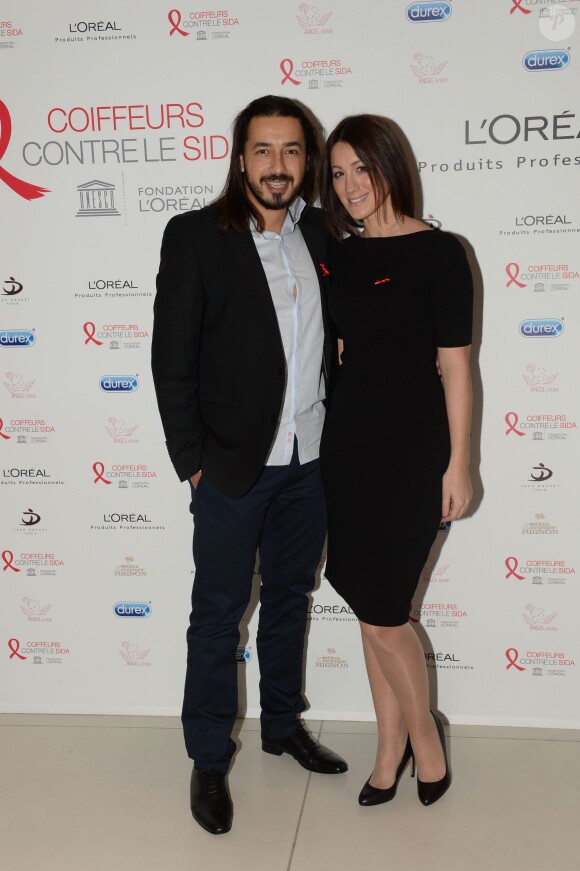 Moundir et sa femme Inès lors de l'opération " Coiffeurs Contre le Sida " édition 2014 à l'Académie L'Oréal Produits Professionnels à Paris, le 1er décembre 2014.