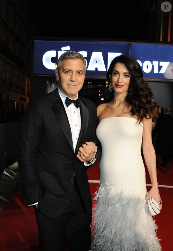 Exclusif - George Clooney et sa femme Amal Alamuddin-Clooney (enceinte) - Arrivées à la 42ème cérémonie des Cesar à la salle Pleyel à Paris, le 24 février 2017.