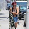 Bella Thorne, cheveux rouges, se promène, assez dénudée, dans les rues de Beverly Hills. Le 11 juillet 2017 © CPA / Bestimage