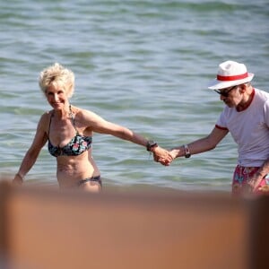 Exclusif - Danièle Gilbert et Patrick Scemama sur la plage de Pampelonne à Saint-Tropez le 7 juillet 2015.