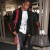 Travis Scott arrive à l'aéroport LAX de Los Angeles, le 29 juin 2017.  Los Angeles, CA - A somber looking Travis Scott holds his head low as he arrives at LAX for a flight out of Los Angeles, after allegedly breaking things off with girlfriend K. Jenner, on June 29th, 2017.29/06/2017 - Los Angeles