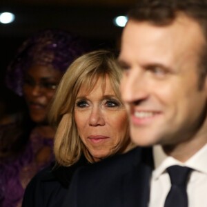 Le président de la République Emmanuel Macron et sa femme la Première Dame Brigitte Macron (Trogneux) - Le président de la République française et sa femme la Première Dame sont accueillis par le président sénégalais et sa femme la Première Dame à l'aéroport international Léopold-Sédar-Senghor à Dakar, Sénégal, le 1er février 2018. © Dominique Jacovides/Bestimage