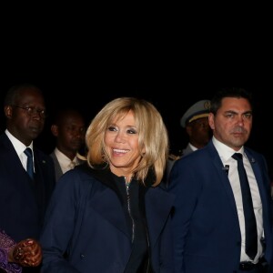 La Première Dame Brigitte Macron (Trogneux) et la Première Dame Marieme Faye Sall - Le président de la République française et sa femme la Première Dame sont accueillis par le président sénégalais et sa femme la Première Dame à l'aéroport international Léopold-Sédar-Senghor à Dakar, Sénégal, le 1er février 2018. © Dominique Jacovides/Bestimage