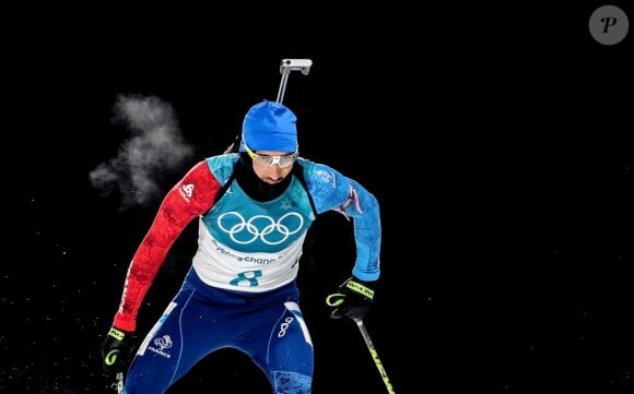 Martin Fourcade décroche la médaille d'or à Pyeongchang en poursuite 12,5 km du biathlon en Corée du sud, le 12 février 2018.