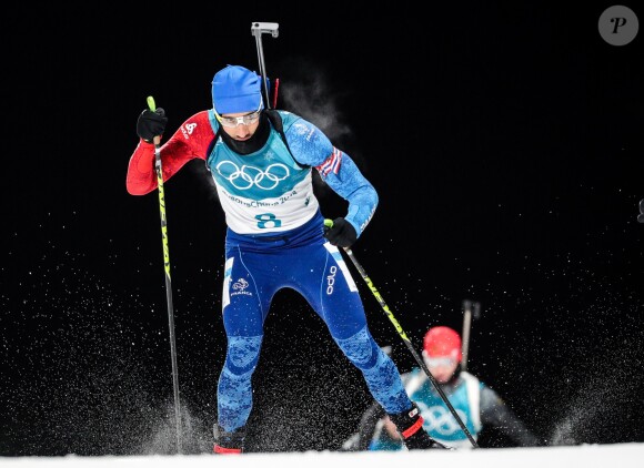 Martin Fourcade décroche la médaille d'or à Pyeongchang en poursuite 12,5 km du biathlon en Corée du sud, le 12 février 2018.