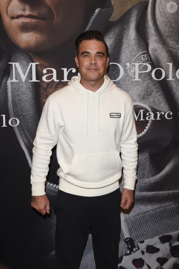 Robbie Williams et sa femme Ayda Field présentent la collection "Robbie Williams x Marc O'Polo" lancée à l'occasion du 50e anniversaire de la marque. Munich, le 6 juillet 2017.
