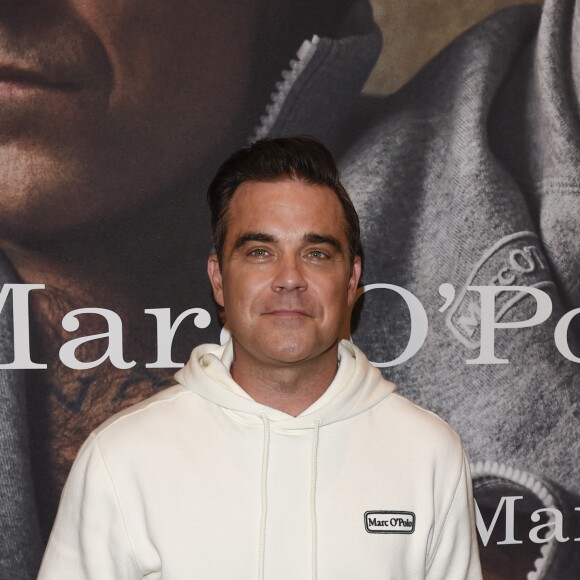 Robbie Williams et sa femme Ayda Field présentent la collection "Robbie Williams x Marc O'Polo" lancée à l'occasion du 50e anniversaire de la marque. Munich, le 6 juillet 2017.