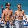 Sharon Stone profite de sa journée avec son nouveau compagnon sur une plage de Miami à la veille des ses 60 ans q'elle fêtera le 10 mars; Miami le 9 mars 2018.  Sharon Stone looked far from single on Thursday as she packed on the PDA with a younger man in Miami and even showed off a diamond ring on her wedding finger. The 59-year-old actress who celebrates her birthday on Saturday, looked incredible in a tiny bikini and striped pants. Miami March 9, 2018.09/03/2018 - Miami