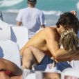 Sharon Stone profite de sa journée avec son nouveau compagnon sur une plage de Miami à la veille des ses 60 ans q'elle fêtera le 10 mars; Miami le 9 mars 2018.  Sharon Stone looked far from single on Thursday as she packed on the PDA with a younger man in Miami and even showed off a diamond ring on her wedding finger. The 59-year-old actress who celebrates her birthday on Saturday, looked incredible in a tiny bikini and striped pants. Miami March 9, 2018.09/03/2018 - Miami