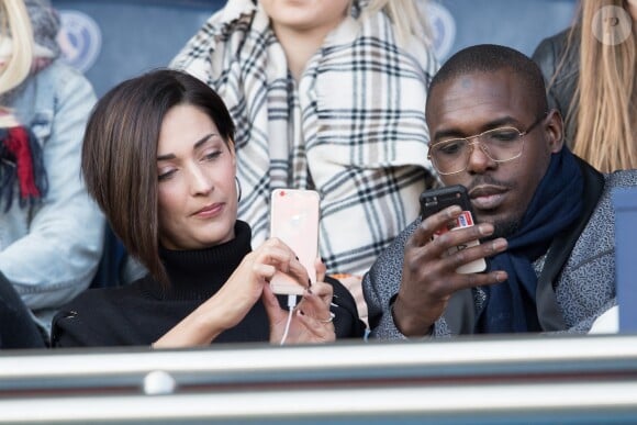 Sheryfa Luna et guest dans les tribunes lors du match de ligue 1 "PSG - Angers (2-0)" au Parc des Princes. Paris, le 14 mars 2018.