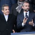 Nicolas Sarkozy et Jean-Claude Blanc dans les tribunes lors du match de ligue 1 "PSG - Angers (2-0)" au Parc des Princes. Paris, le 14 mars 2018.