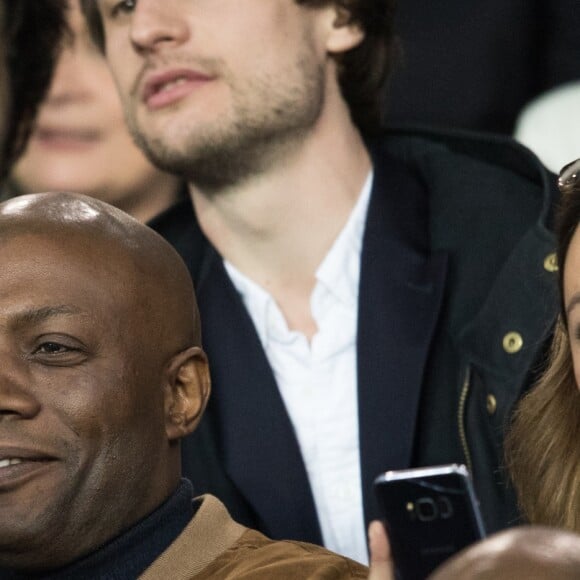 Harry Roselmack et Sandrine Quétier dans les tribunes du Parc des Princes lors du match du Paris Saint-Germain (PSG) contre l'En Avant Guingamp (EAG) à Paris, le 29 avril 2018 (score final : 2-2). © Cyril Moreau/Bestimage