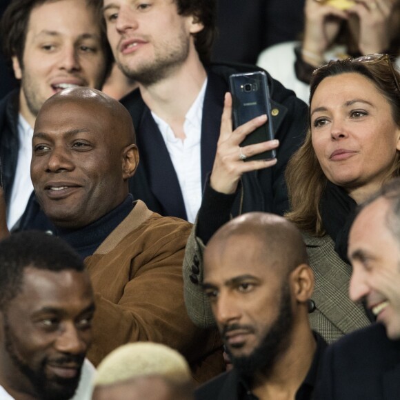 Harry Roselmack et Sandrine Quétier dans les tribunes du Parc des Princes lors du match du Paris Saint-Germain (PSG) contre l'En Avant Guingamp (EAG) à Paris, le 29 avril 2018 (score final : 2-2). © Cyril Moreau/Bestimage