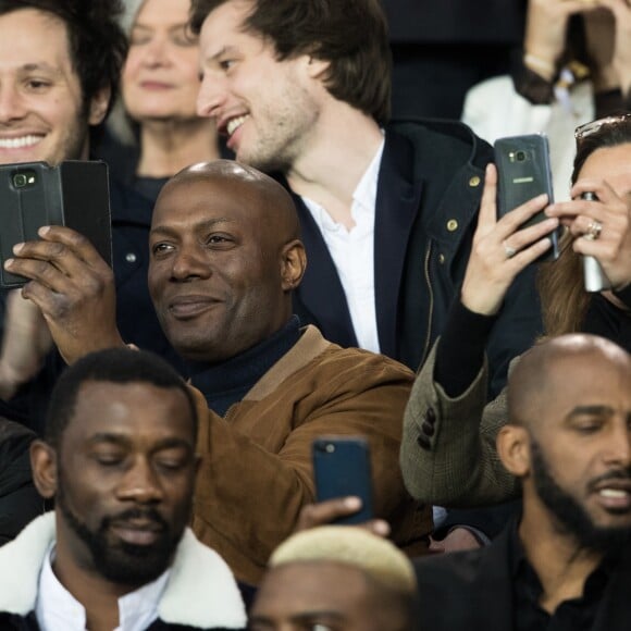 Harry Roselmack et Sandrine Quétier dans les tribunes du Parc des Princes lors du match du Paris Saint-Germain (PSG) contre l'En Avant Guingamp (EAG) à Paris, le 29 avril 2018 (score final : 2-2). © Cyril Moreau/Bestimage