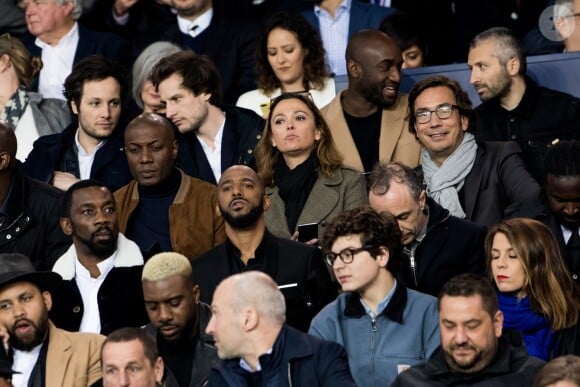 Vianney, Virgil Abloh, Harry Roselmack, Sandrine Quétier avec son compagnon Sébastien Goales, Stomy Bugsy (Gilles Duarte), Passi (Passi Balende) et Kevin Razy dans les tribunes du Parc des Princes lors du match du Paris Saint-Germain (PSG) contre l'En Avant Guingamp (EAG) à Paris, le 29 avril 2018 (score final : 2-2). © Cyril Moreau/Bestimage