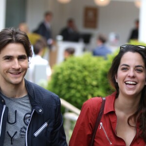 Julien Dereims (habillé par Eden Park) et sa compagne Anouchka Delon (Habillée par La Redoute) People au village des Internationaux de Tennis de Roland Garros le 27 mai 2016. © Dominique Jacovides / Bestimage