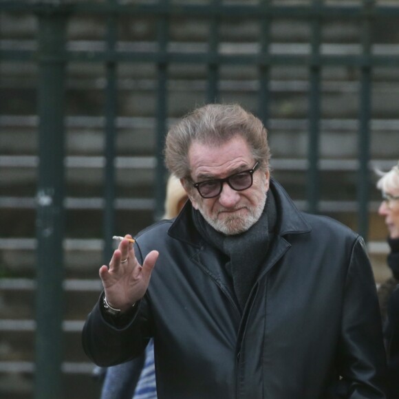 Eddy Mitchell et sa femme Muriel - Sorties de l'église de la Madeleine après les obsèques de Johnny Hallyday à Paris - Le 9 décembre 2017