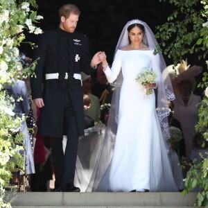 Le prince Harry, duc de Sussex, et Meghan Markle, duchesse de Sussex, à la sortie de chapelle St. George au château de Windsor après la cérémonie de leur mariage, le 19 mai 2018.