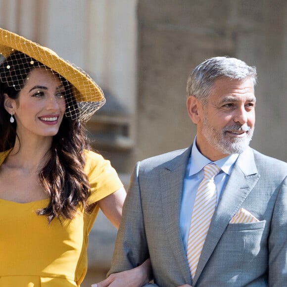 George Clooney et sa femme Amal Alamuddin Clooney - Les invités à la sortie de la chapelle St. George au château de Windsor, Royaume Uni, le 19 mai 2018.