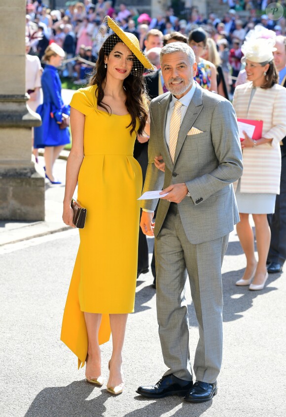 George Clooney et sa femme Amal Clooney arrivent à la chapelle St. George pour le mariage du prince Harry et de Meghan Markle au château de Windsor, Royaume Uni, le 19 mai 2018.