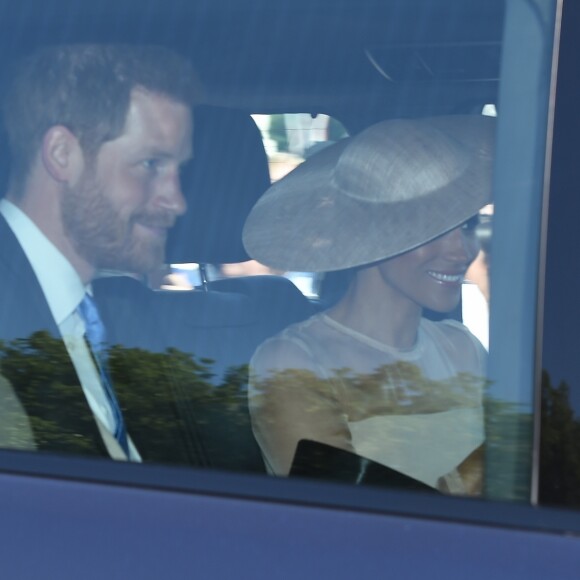 Le prince Harry, duc de Sussex, et Meghan Markle, duchesse de Sussex, arrivent à Buckingham Palace le 23 mai 2018 pour une garden party en l'honneur des patronages et associations soutenues par le prince Charles dans le cadre des célébrations de son 70e anniversaire le 14 novembre 2018.