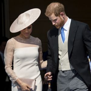 Le prince Harry, duc de Sussex, et Meghan Markle, duchesse de Sussex, à Buckingham Palace le 23 mai 2018 pour une garden party en l'honneur des patronages et associations soutenues par le prince Charles dans le cadre des célébrations de son 70e anniversaire le 14 novembre 2018.