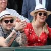 Jeff Panacloc et sa femme Charlotte de Hugo dans les tribunes lors des internationaux de France de tennis de Roland Garros le 30 mai 2018. © Cyril Moreau - Dominique Jacovides/Bestimage