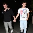 Exclusif - Sam Smith et son compagnon Brandon Flynn se baladent main dans la main dans les rues de Beverly Hills après un diner romantique au restaurant Matsuhisa, le 5 juin 2018