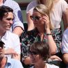 Alain-Fabien Delon et Kiera Chaplin dans les tribunes lors des internationaux de France de Roland Garros à Paris le 7 juin 2018. © Cyril Moreau / Bestimage
