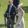 Le prince Harry, duc de Sussex, et Meghan Markle, duchesse de Sussex, à Buckingham Palace le 23 mai 2018 pour une garden party en l'honneur des patronages et associations soutenues par le prince Charles dans le cadre des célébrations de son 70e anniversaire le 14 novembre 2018.