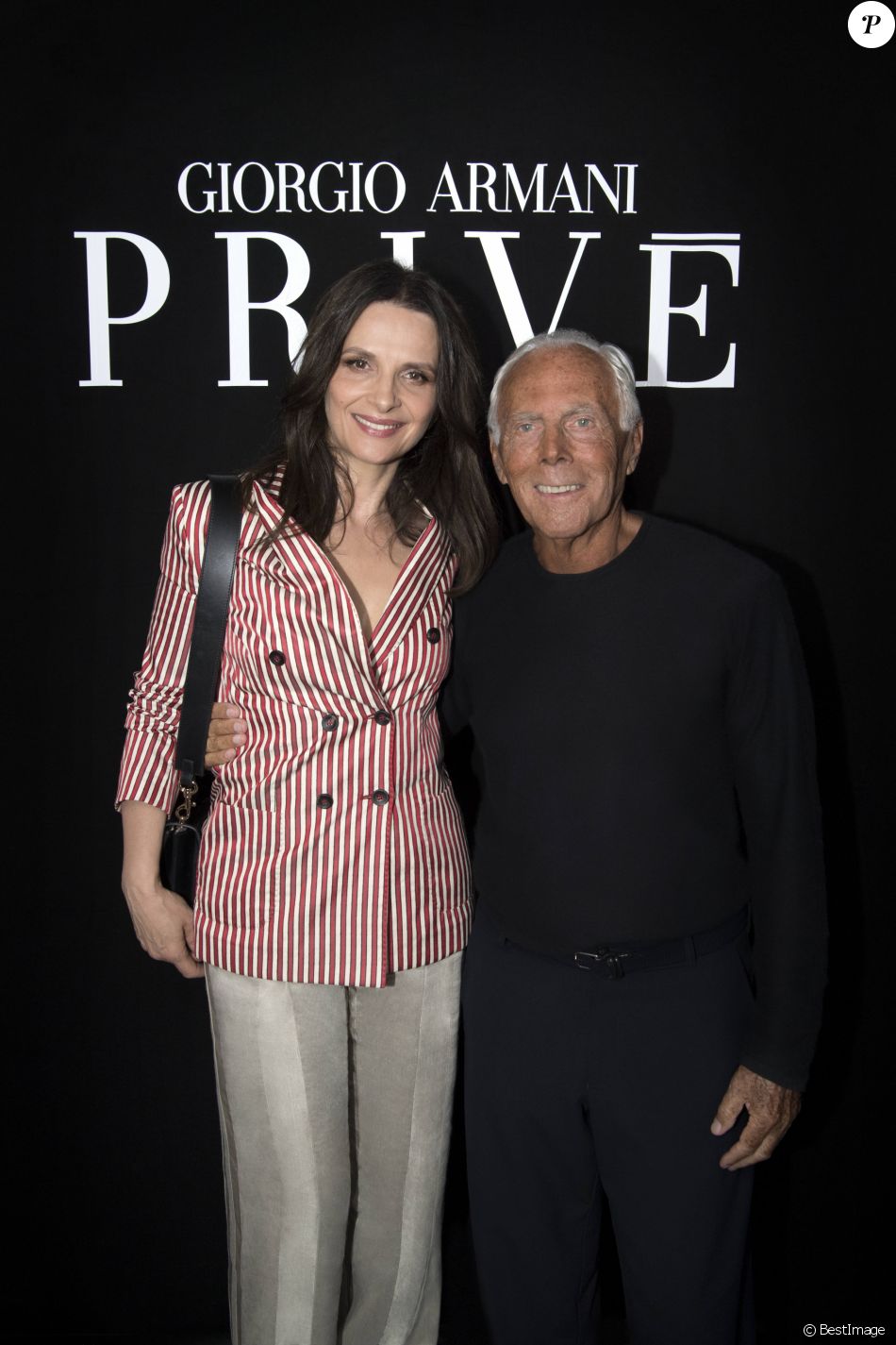 Juliette Binoche et Giorgio Armani - Défilé Giorgio Armani Privé,  collection Haute Couture automne-hiver 2018/19 à Paris, le 3 juillet 2018.  - Purepeople