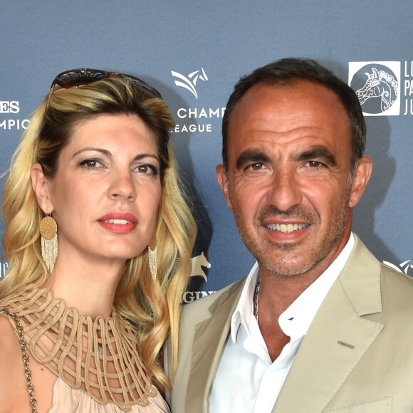 Exclusif - Nikos Aliagas et son épouse Tina Grigoriou - Photocall du Longines Paris Eiffel Jumping au Champ de Mars à Paris le 7 juillet 2018. ©Veeren-Perusseau/Bestimage !!! NO web NO blog !!! For Germany call for price Exclusive - Longines Paris Eiffel Jumping in Paris, France, on July 7th 201807/07/2018 - Paris