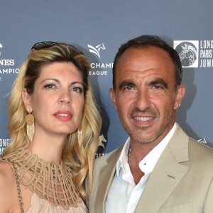 Exclusif - Nikos Aliagas et sa femme Tina Grigoriou - Photocall du Longines Paris Eiffel Jumping au Champ de Mars à Paris le 7 juillet 2018. ©Veeren-Perusseau/Bestimage