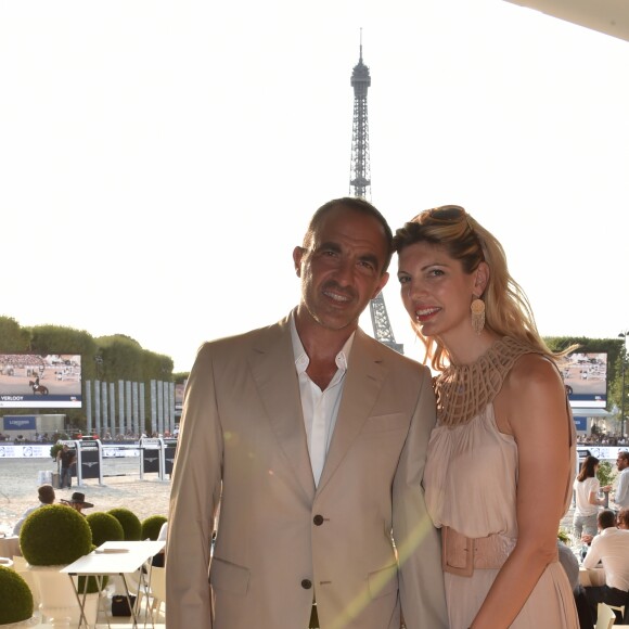 Exclusif - Nikos Aliagas et sa femme Tina Grigoriou - People lors du Longines Paris Eiffel Jumping au Champ de Mars à Paris le 7 juillet 2018. © Perusseau/Veeren/Bestimage