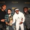 Steven Nzonzi, Adil Rami, Paul Pogba et Samuel Umtiti posent avec le trophée de la Coupe du monde FIFA 2018 - People lors de la soirée 'Maxim Hot 100' dans la salle de spectacle Hollywood Paladium à Los Angeles, le 21 juillet 2018.