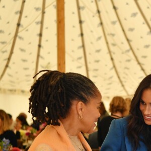 Meghan Markle, duchesse de Sussex, le prince Harry et Doria Ragland, mère de Meghan, lors d'une réception au palais de Kensington en l'honneur des auteures du livre de recettes Together, le 20 septembre 2018 à Londres.